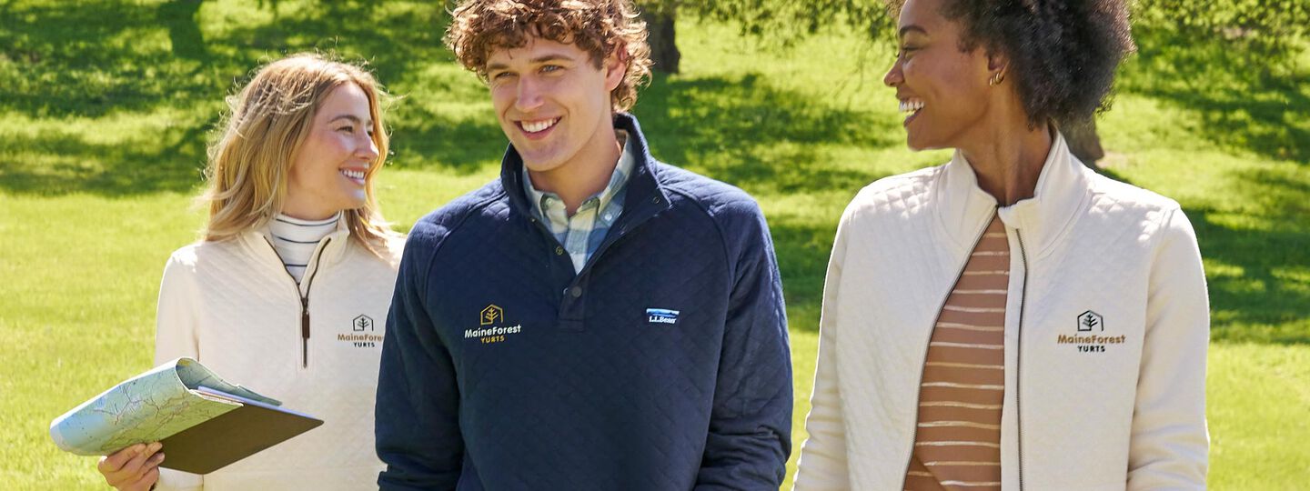 Three models outside wearing Quilted Sweatshirts with Logos
